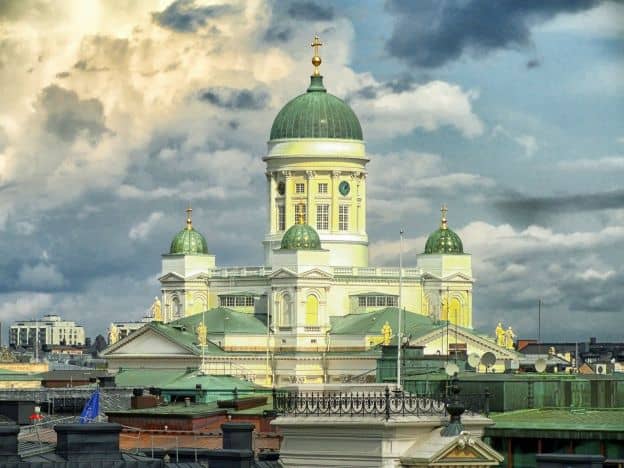 Helsinki Cathedral, with its cream-colored walls and green domes, dominates the skyline in Helsinki.