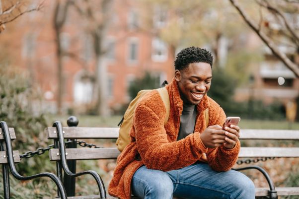 Man smiles while using a language exchange app