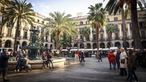 Photo of people in a plaza in Barcelona, Spain.