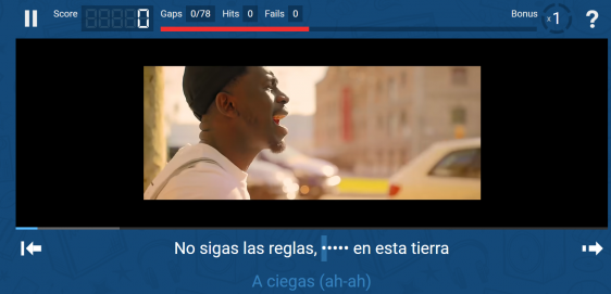 A screenshot showing a music video with a man singing and Spanish song lyrics with one word missing.