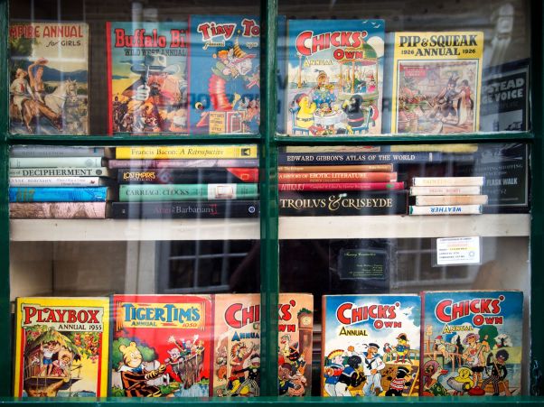 Annuals and comics in the window of a second-hand bookshop 